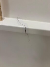 Our shower had a large crack in it.