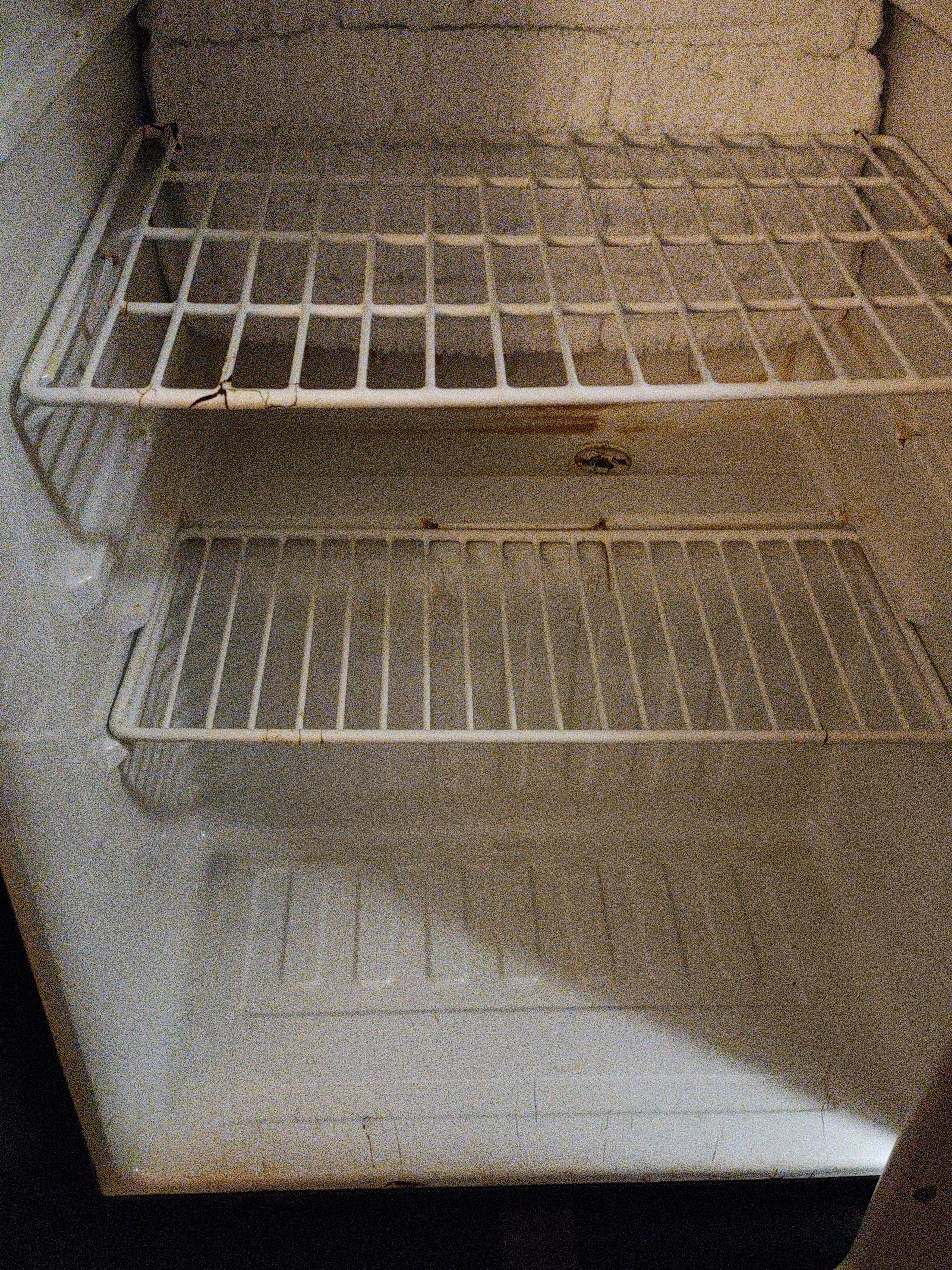 Fridge looks like it hasn't been cleaned at all in a week or so 