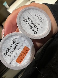 Used poked coffee pods