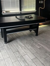 Pool/ping pong table. Loo sided due to missing leg piece