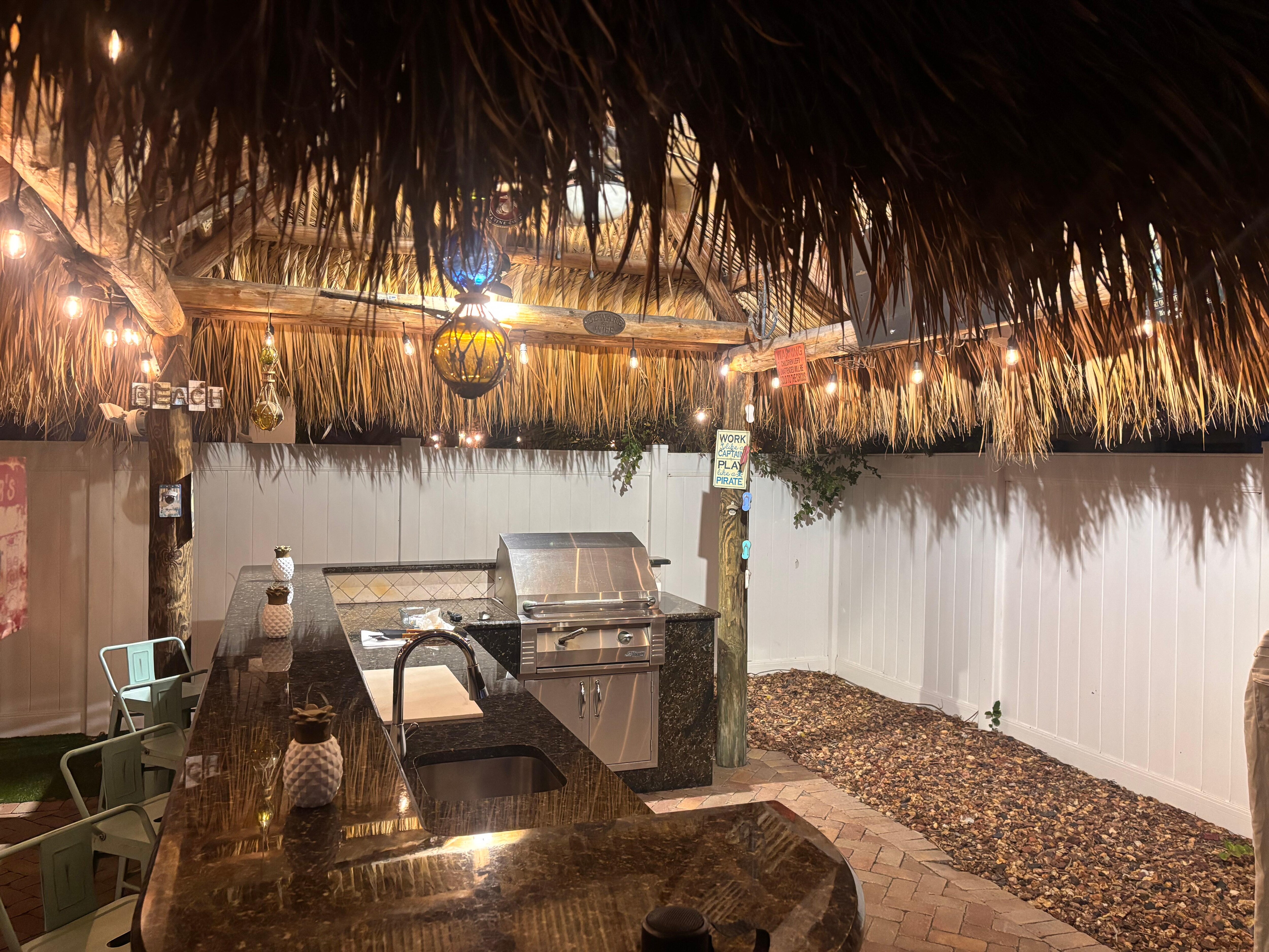 Tiki hut and outdoor kitchen