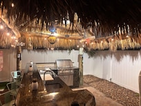 Tiki hut and outdoor kitchen