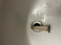 Bathroom sink clogged with something and clearly not clean!