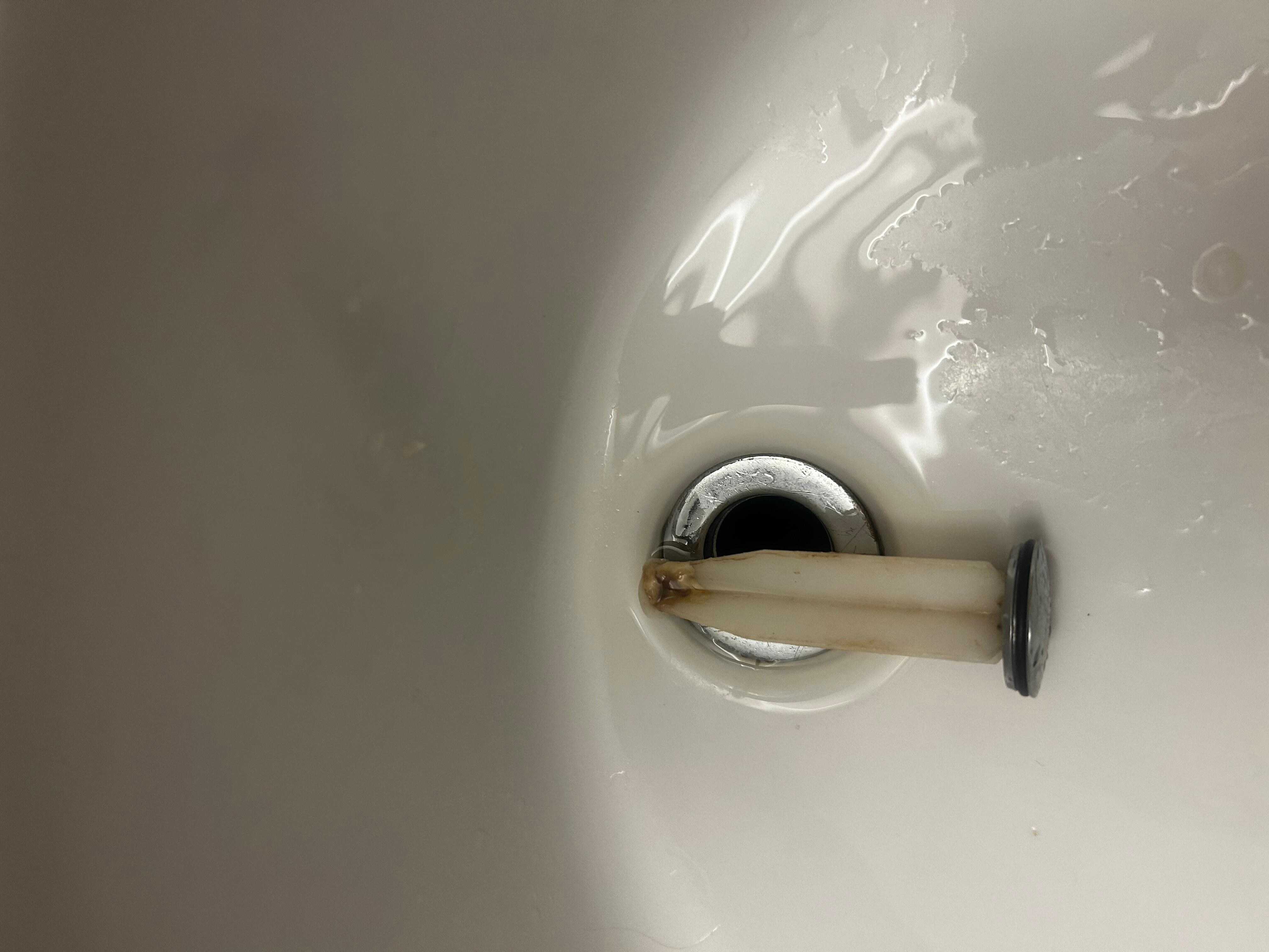 Bathroom sink clogged with something and clearly not clean!