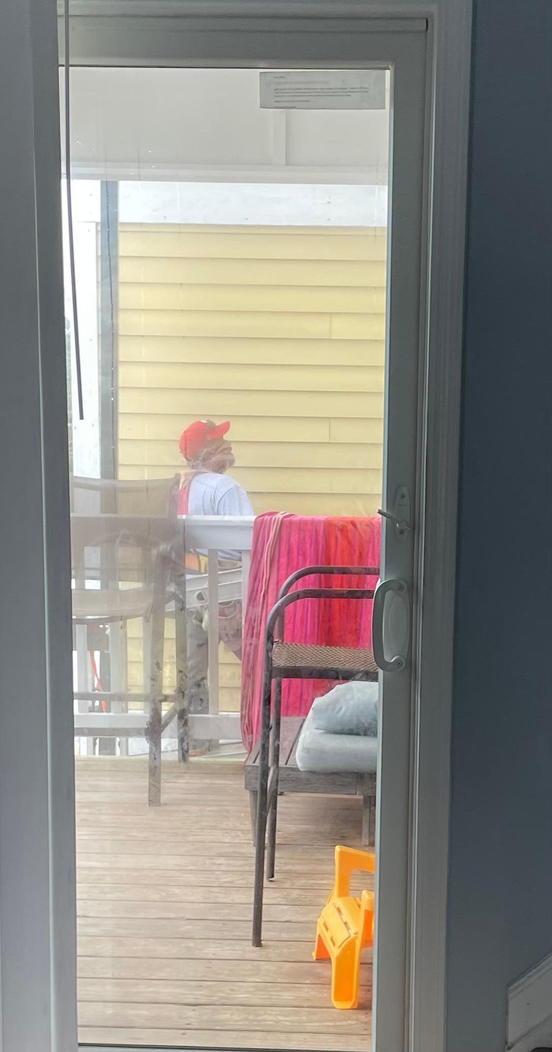 Workers right next to the balcony 