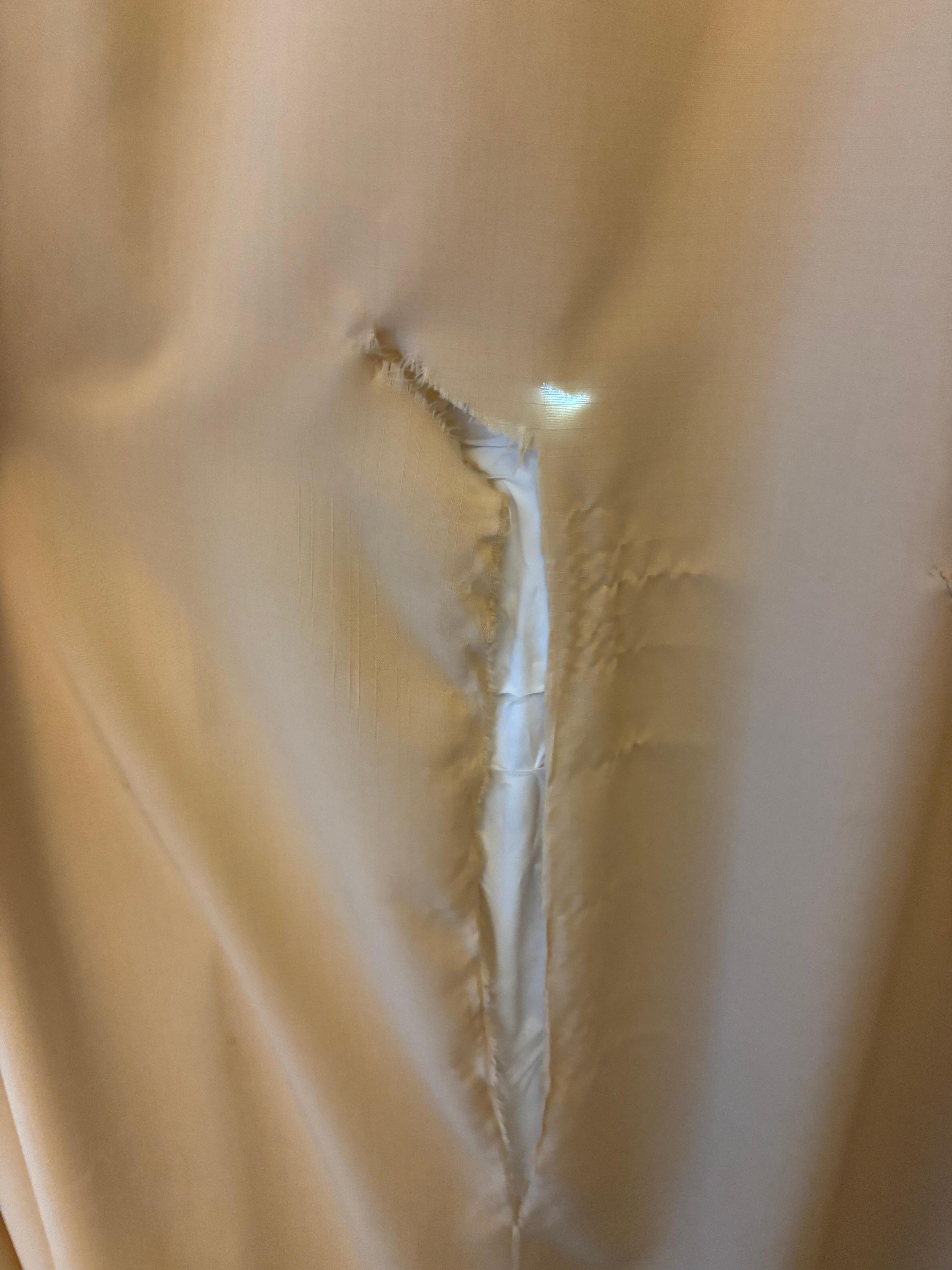Torn black-out blinds