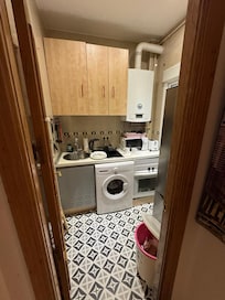 Tiny kitchen, you can’t open the freezer without moving the garbage, the oven door almost hits the fridge when opened.