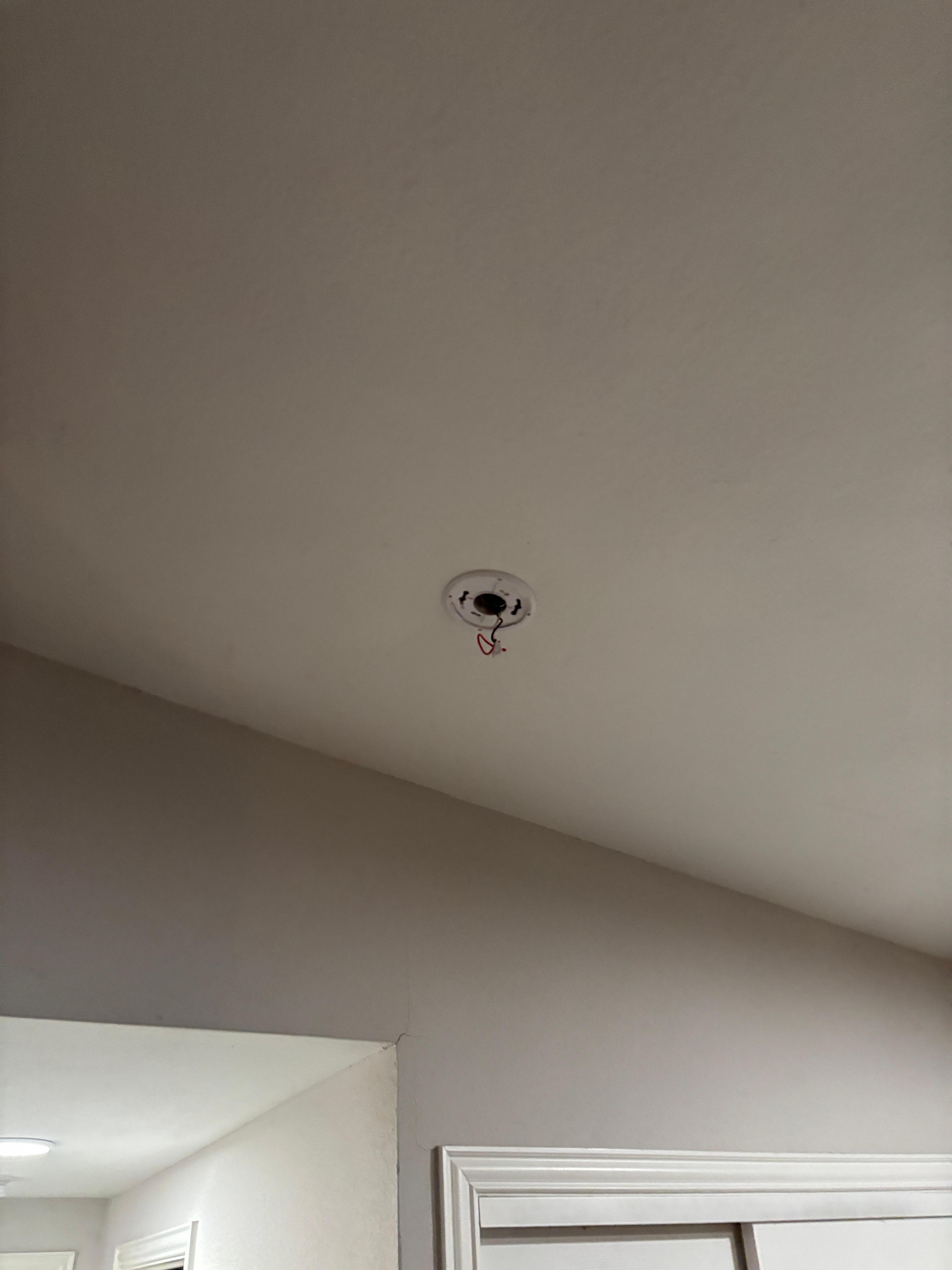 Missing smoke detector, with wires hanging down. 