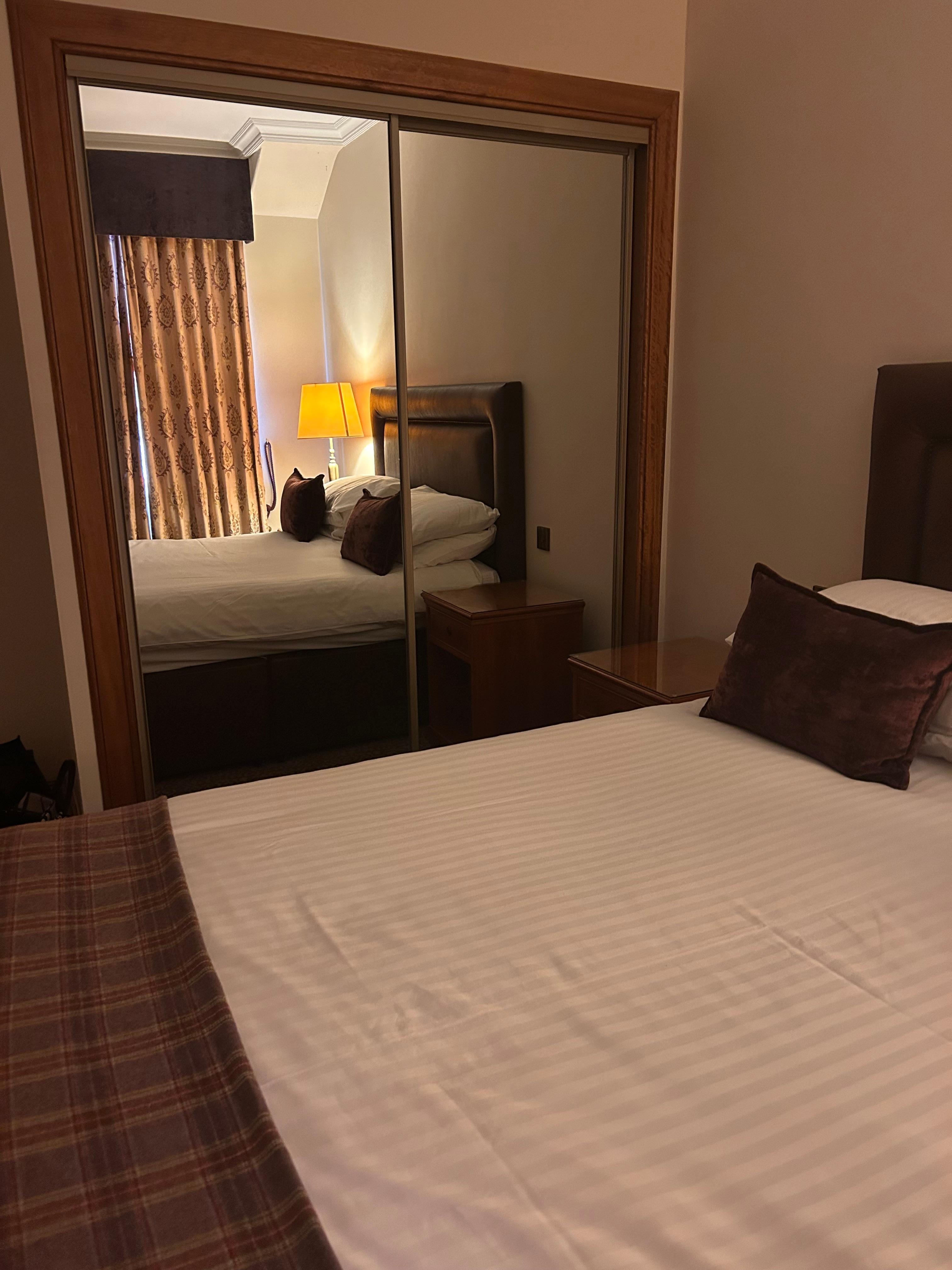 Wardrobe storage with robes, slippers and a safe