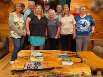 In livingroom in front of fireplace