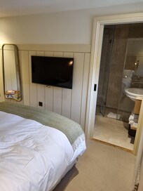 Cosy bedroom looking towards bathroom