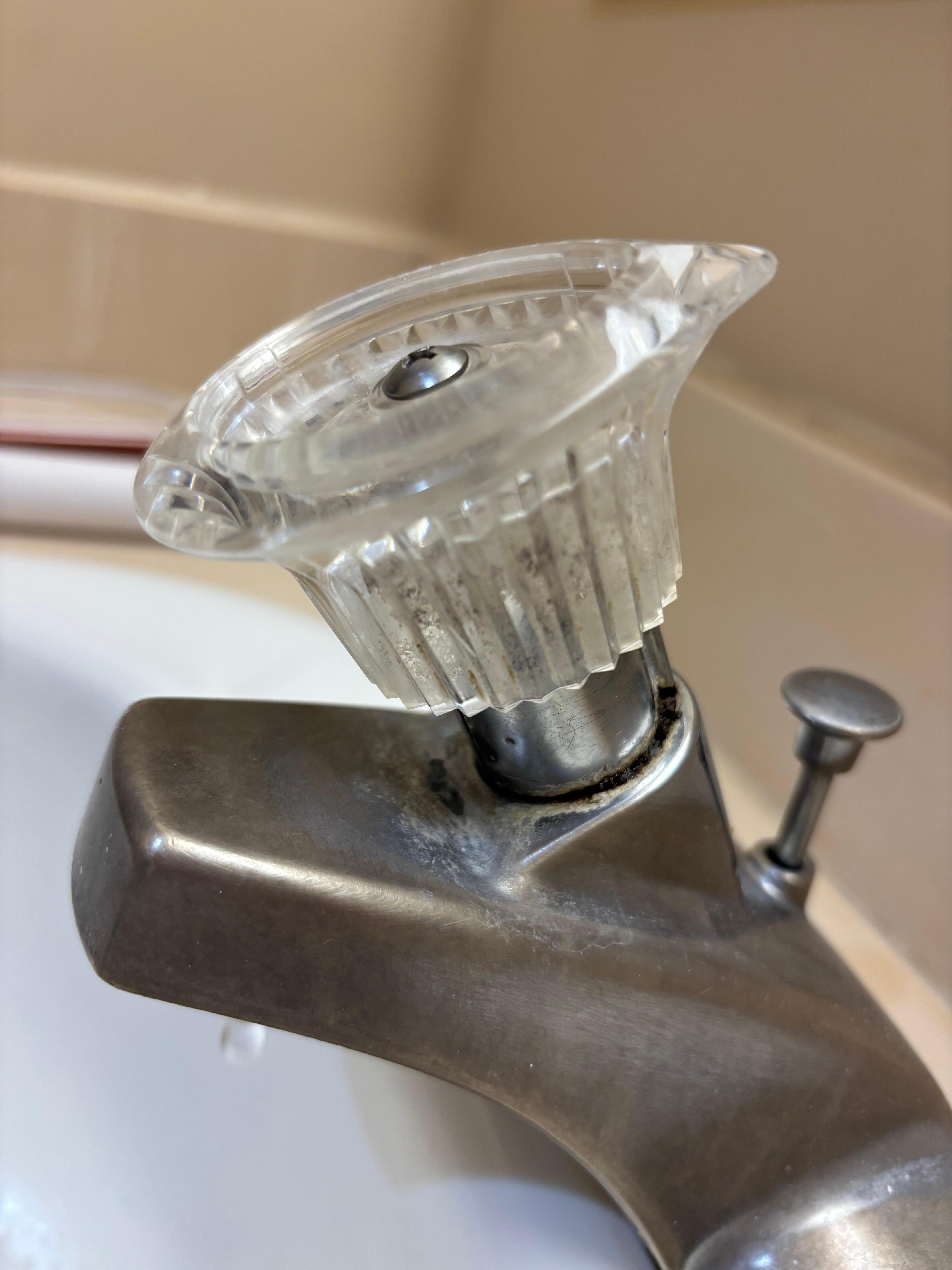 Mold growing under/inside sink handle 