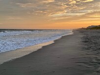 Sunset on the beach at the property