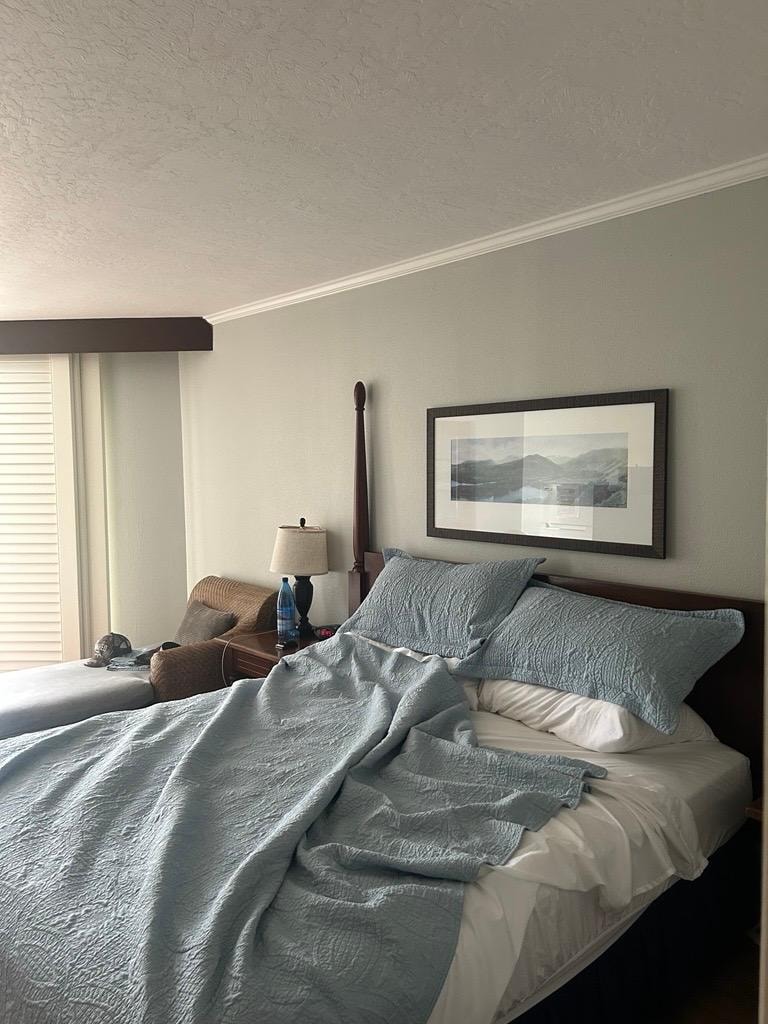 Photo of the bed. The sheets were polyester and there was a dip on the left side. The pillows were very comfortable!