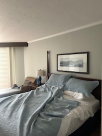 Photo of the bed. The sheets were polyester and there was a dip on the left side. The pillows were very comfortable!