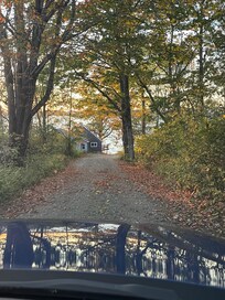 Driveway down to house on left.