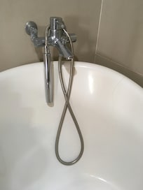 Cracked tub and stained hose.