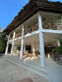 Main building with reception and restaurant on the second floor, also serving the breakfast.