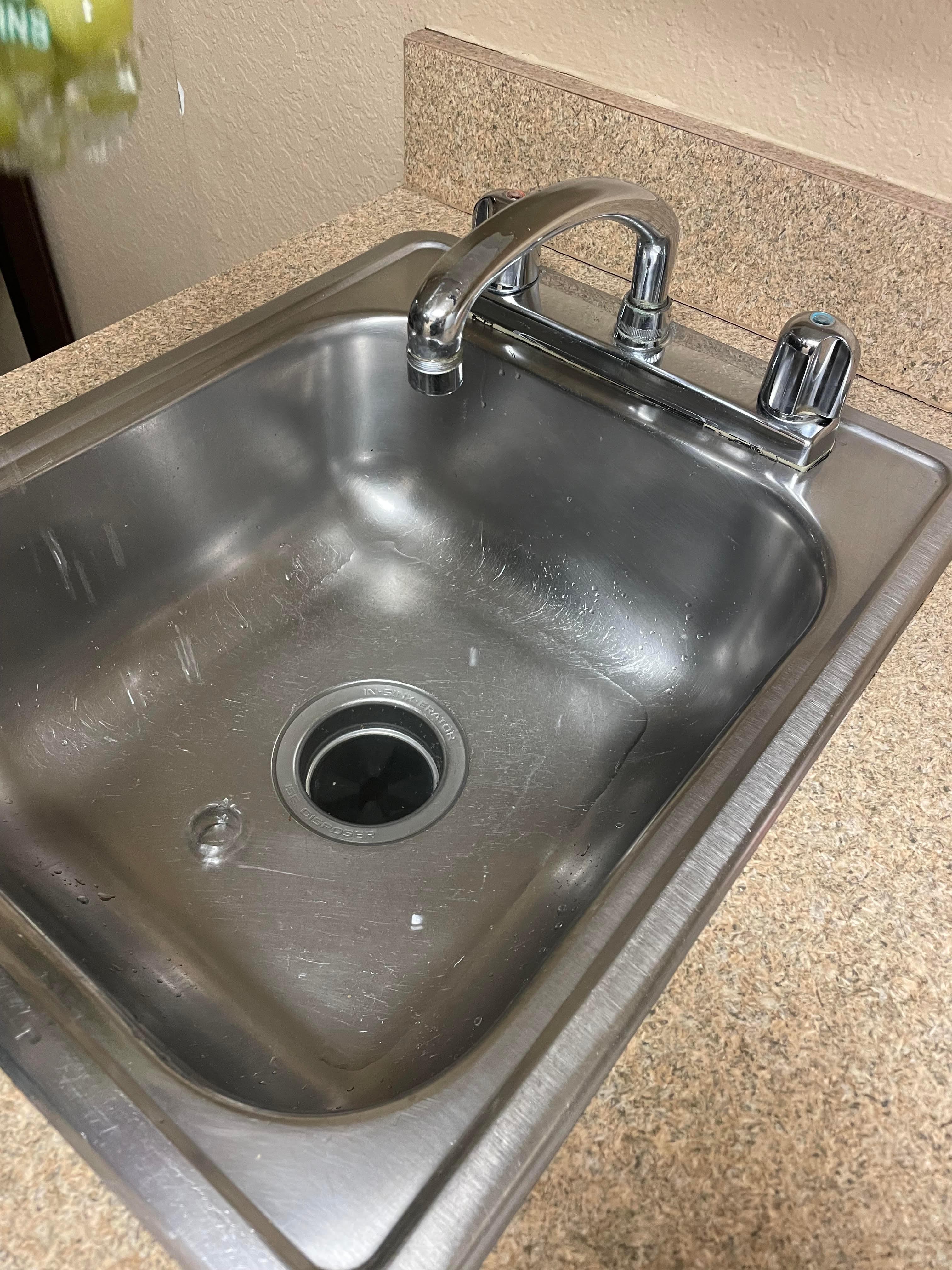 We brought groceries but the sink was clogged with standing water & the stove was literally MISSING!