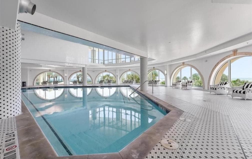 Giant indoor heated pool with comfortable chairs for the parents to sit in while the kids played for hours.  