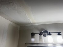 Patch job in bathroom from water above room. The 4 different light bulbs is my favorite