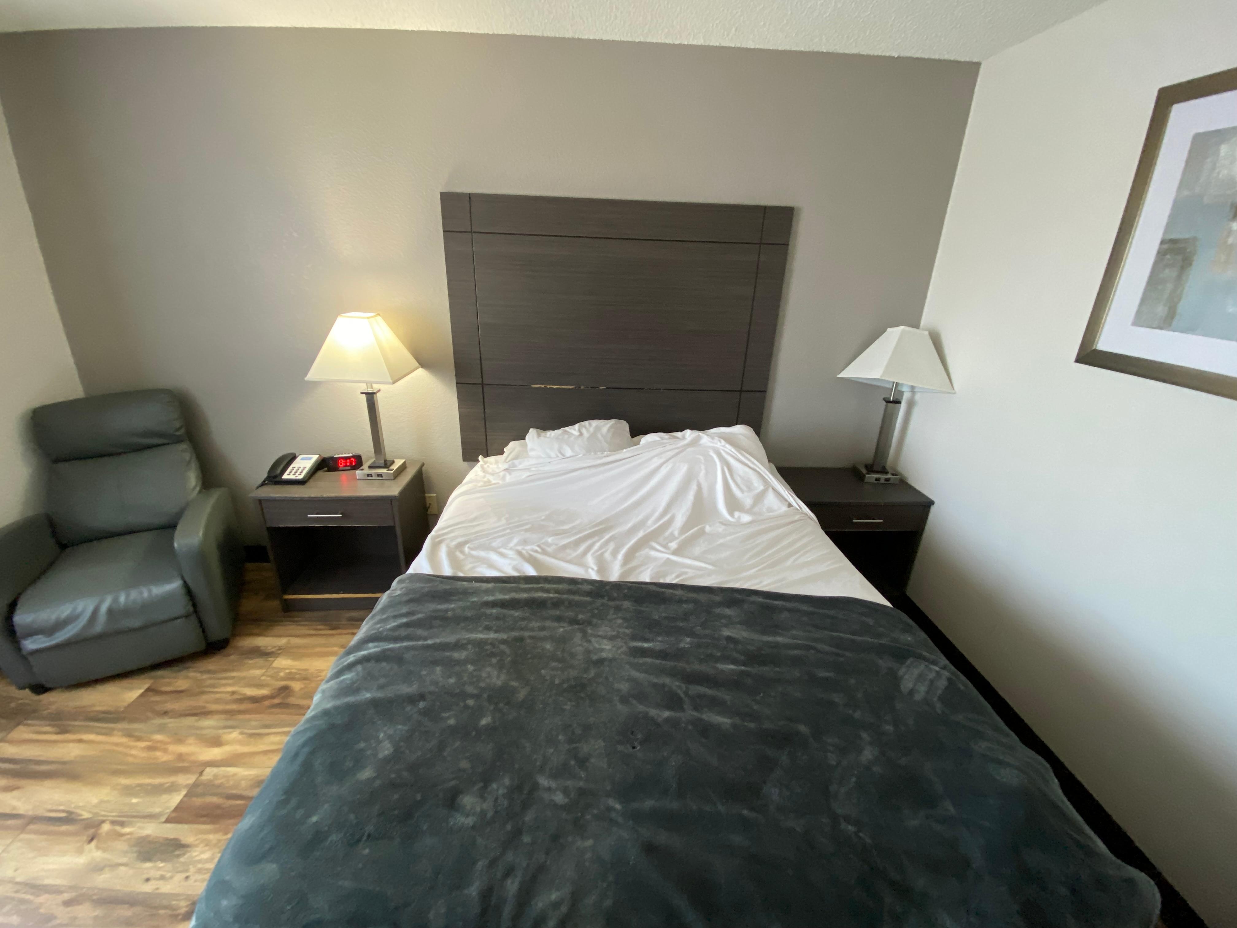 The bed. No major blemishes, with the exception of some holes in the gray blanket.