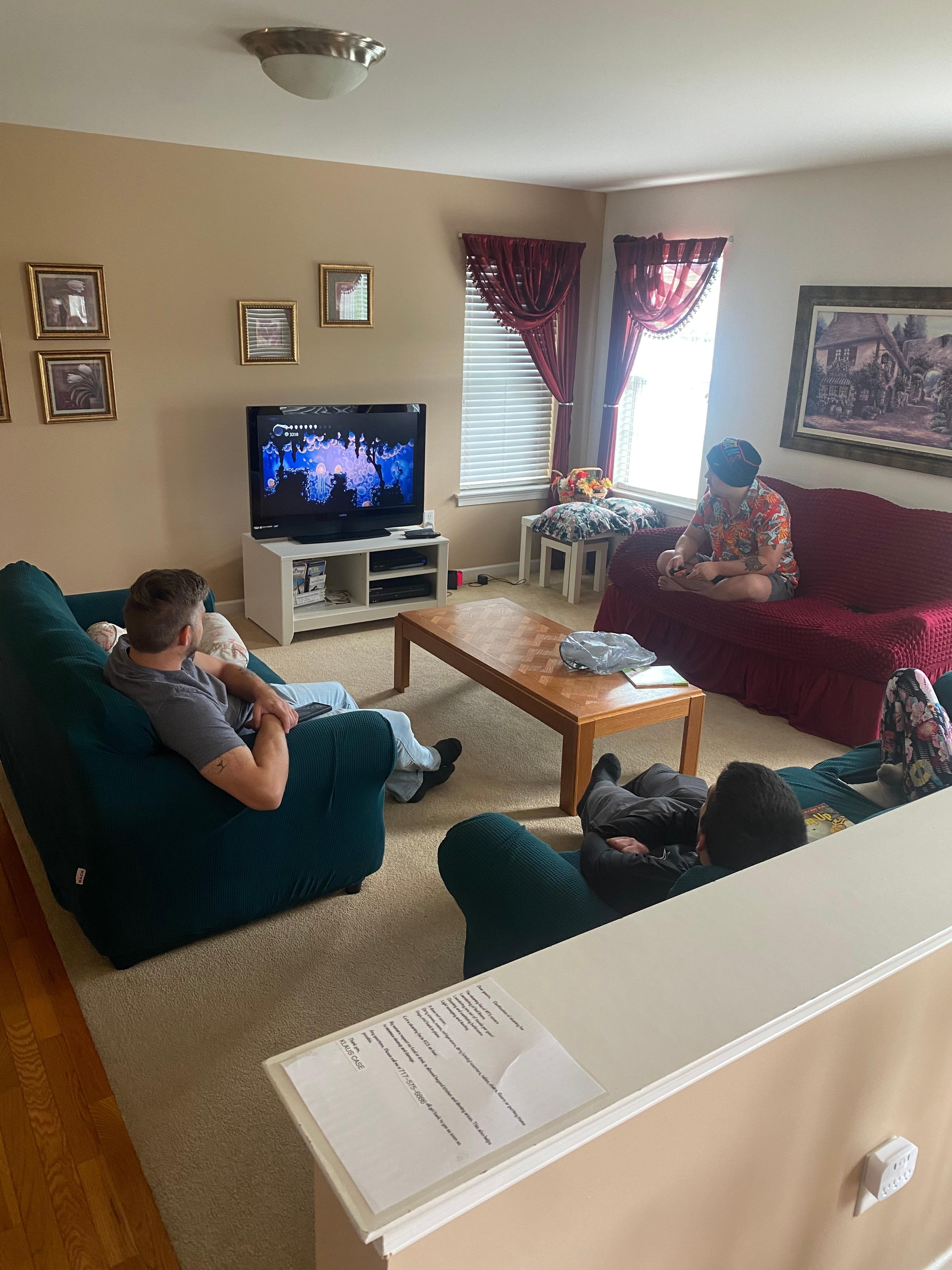 Playing video games in the spacious living room 