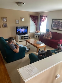 Playing video games in the spacious living room
