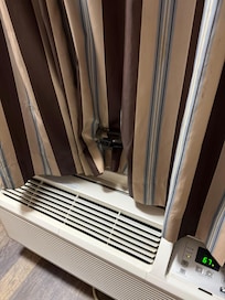 We needed to use hair clips to keep the AC unit from opening the curtains.