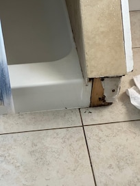 Missing tile and mildew in bathroom