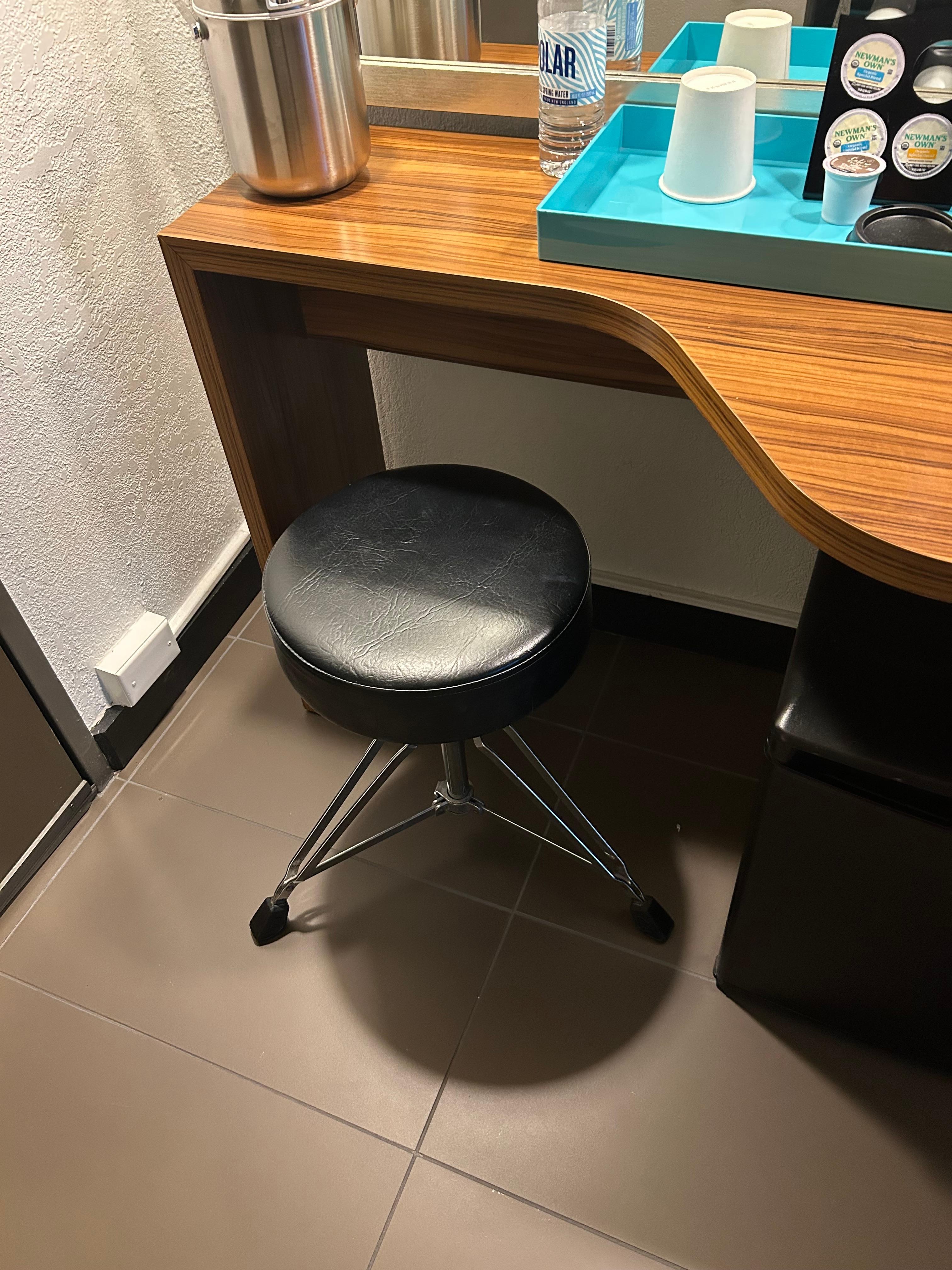 Attention to every detail. The vanity chair was a drum stool.