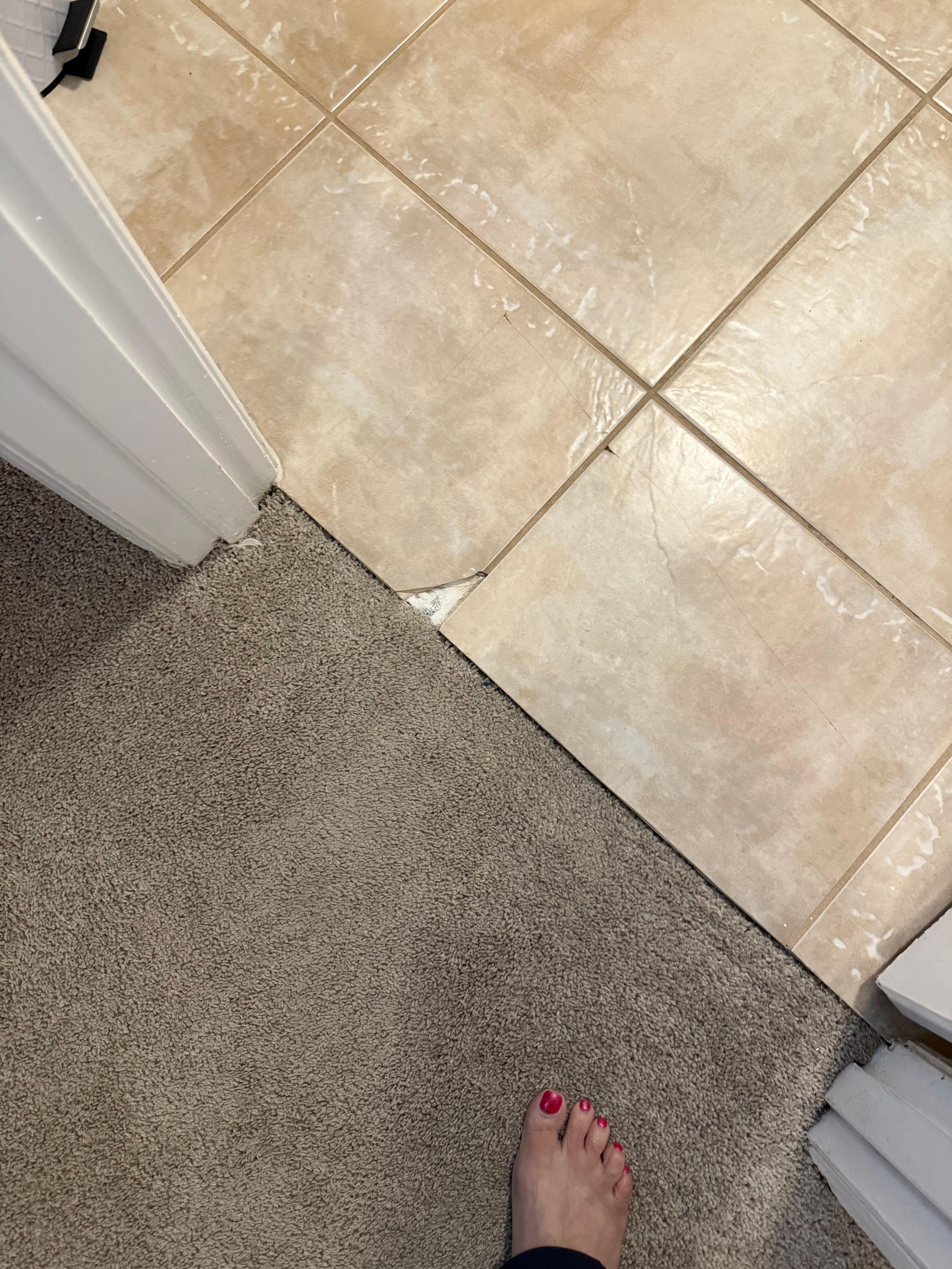 Broken tiles Which one of our guest cut their foot on. All the floors were dirty and in need of repair.