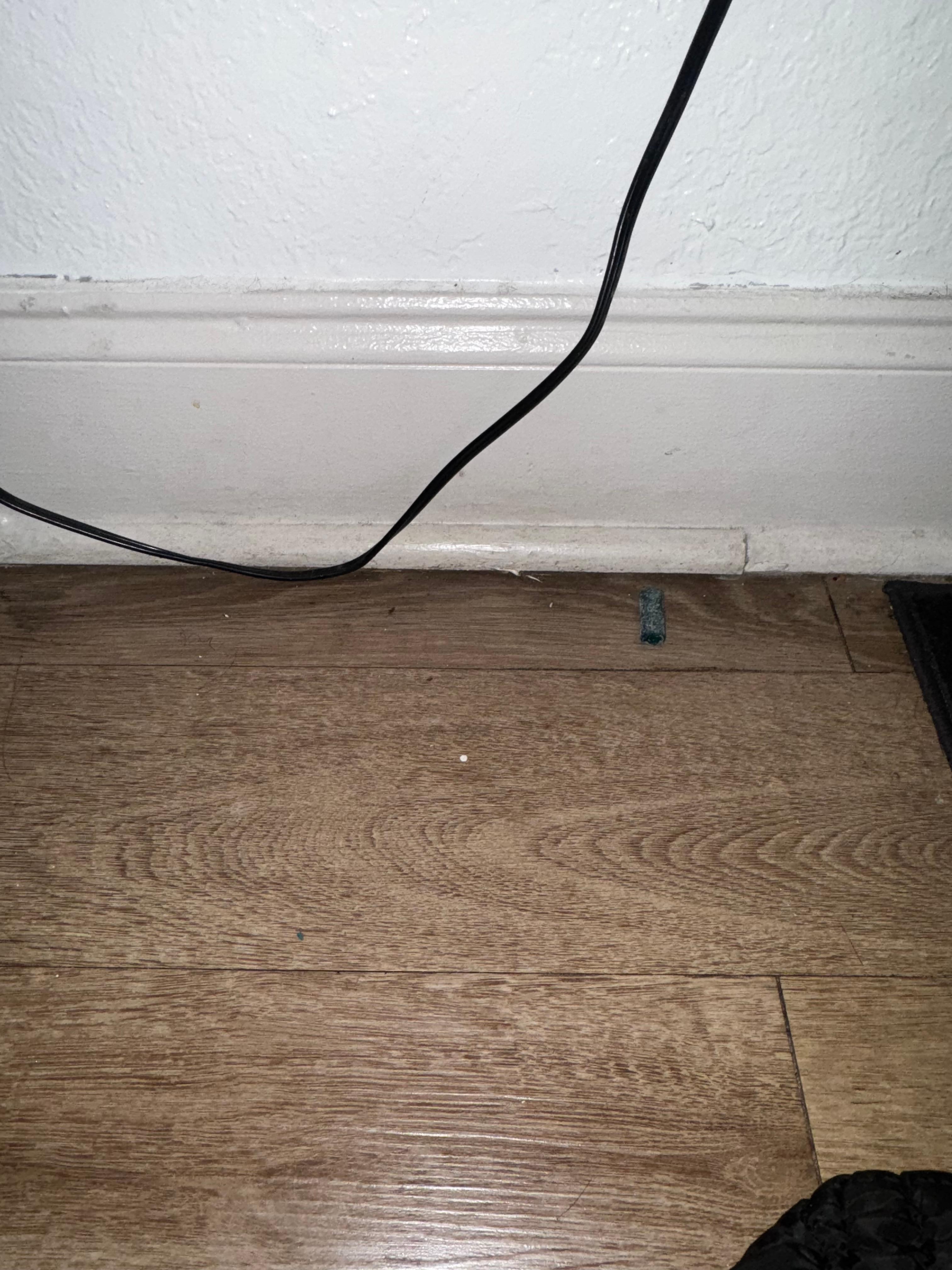 Under end table between beds