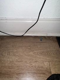 Under end table between beds