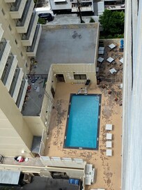 Closed pool and part of the breakfast deck in disrepair