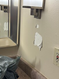 Restroom sink wall peeling
