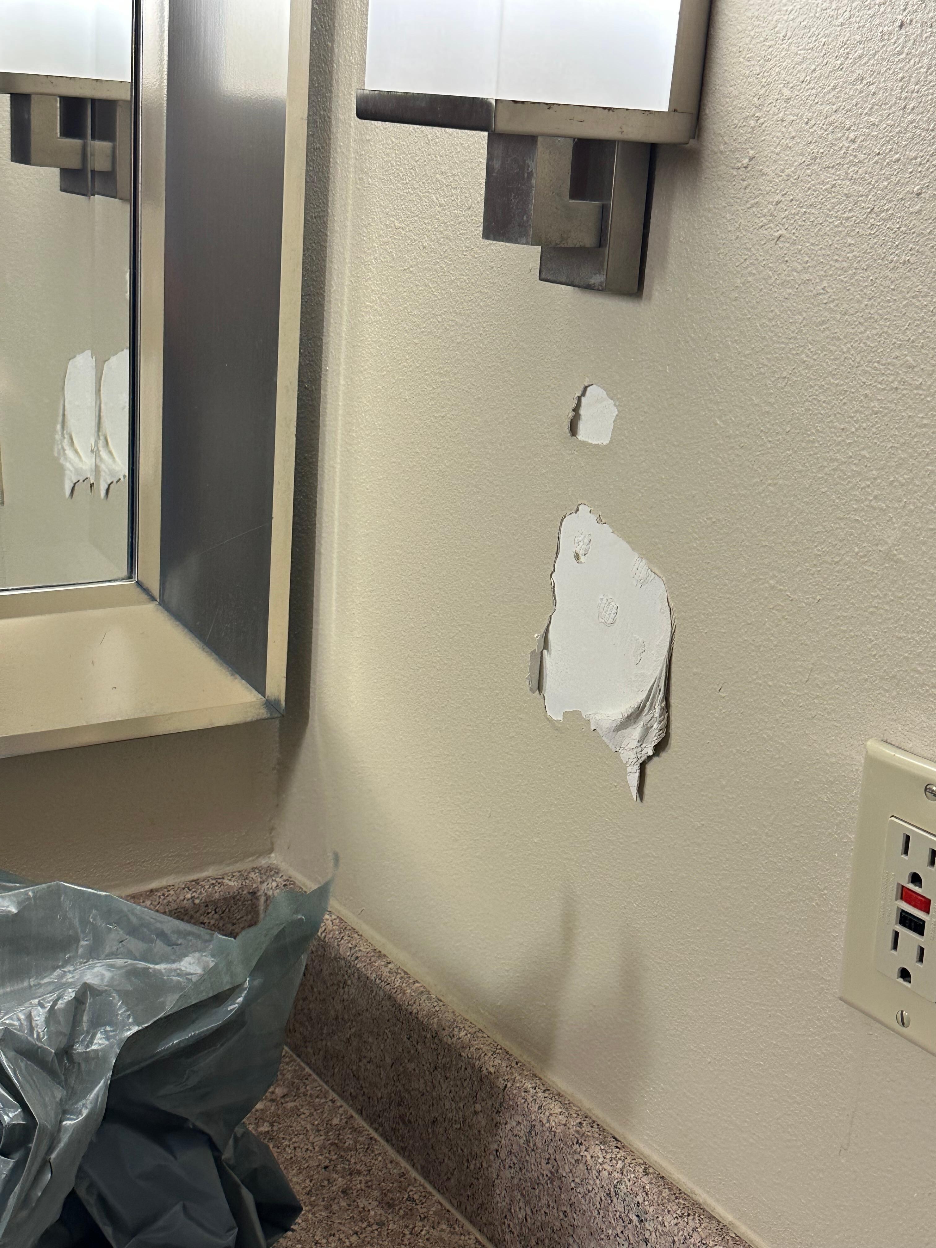 Restroom sink wall peeling