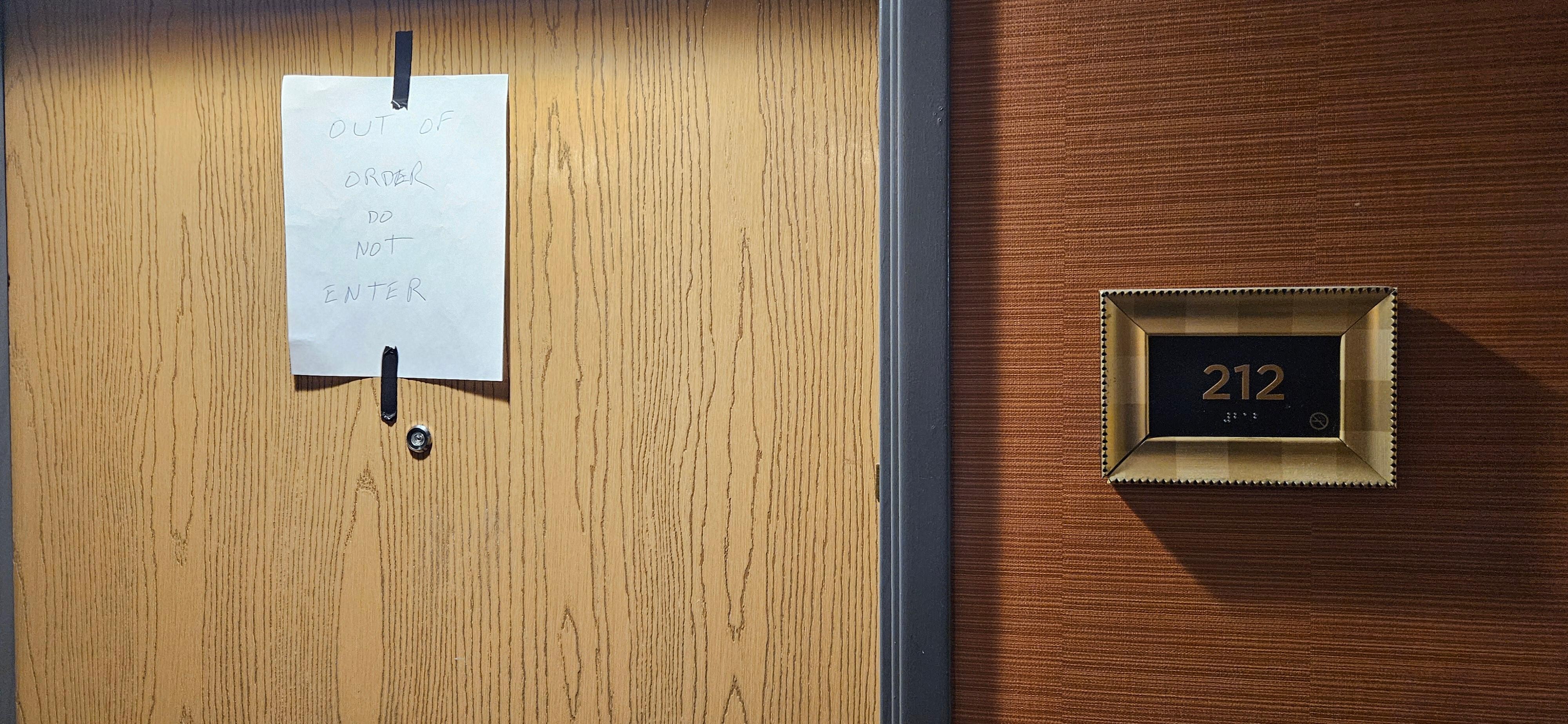 Note on door of room initially assigned to