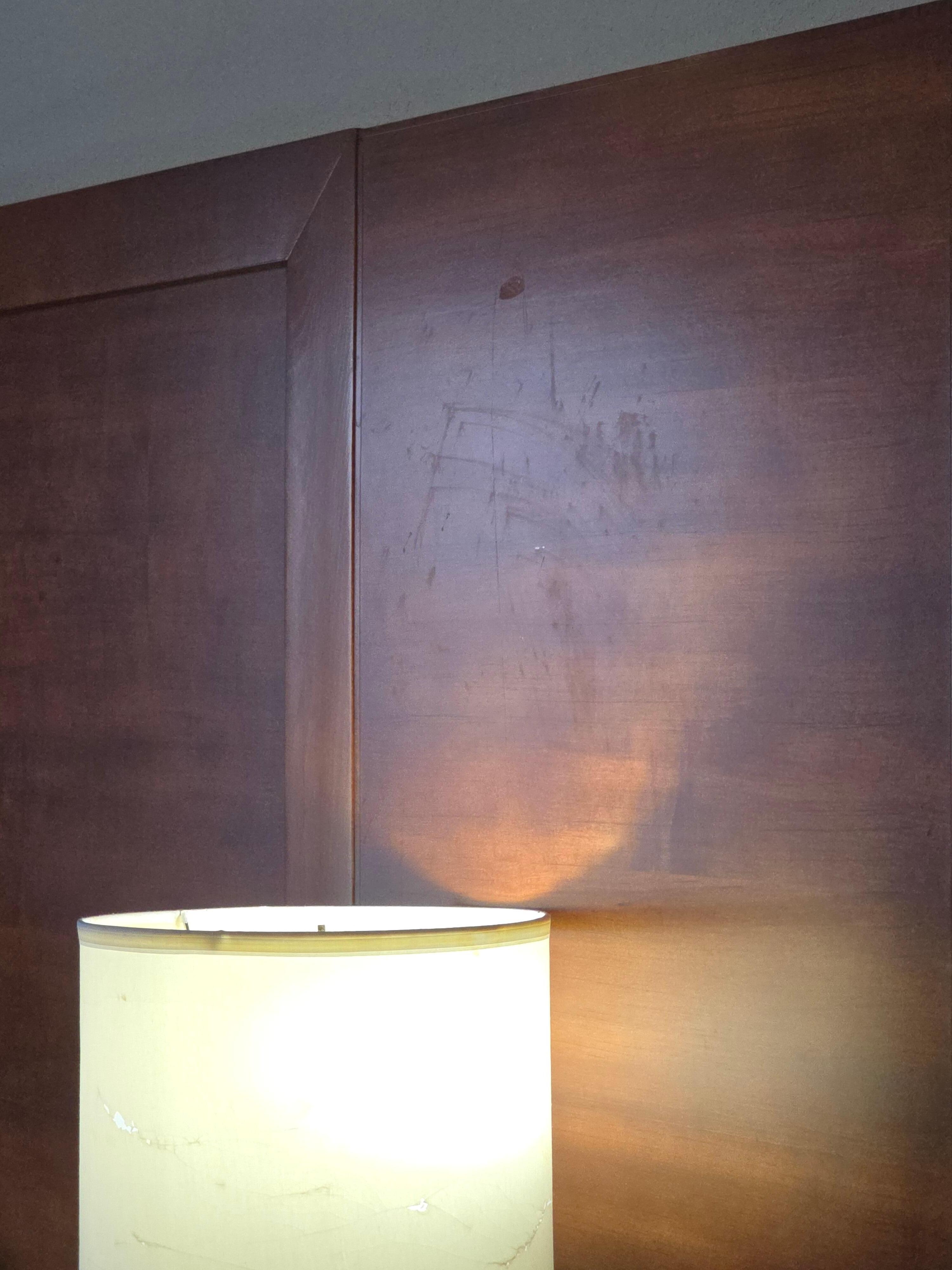 Headboard had something splattered all over it.