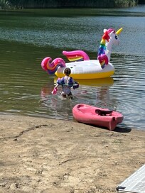 My neice wading out to the unicorn float (the kayak comes with the property, but not the float.)
