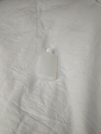 Bottle found under the blankets in room 218