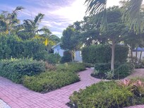 Outside area gave a sense of privacy with pathways and small patio for each cottage.