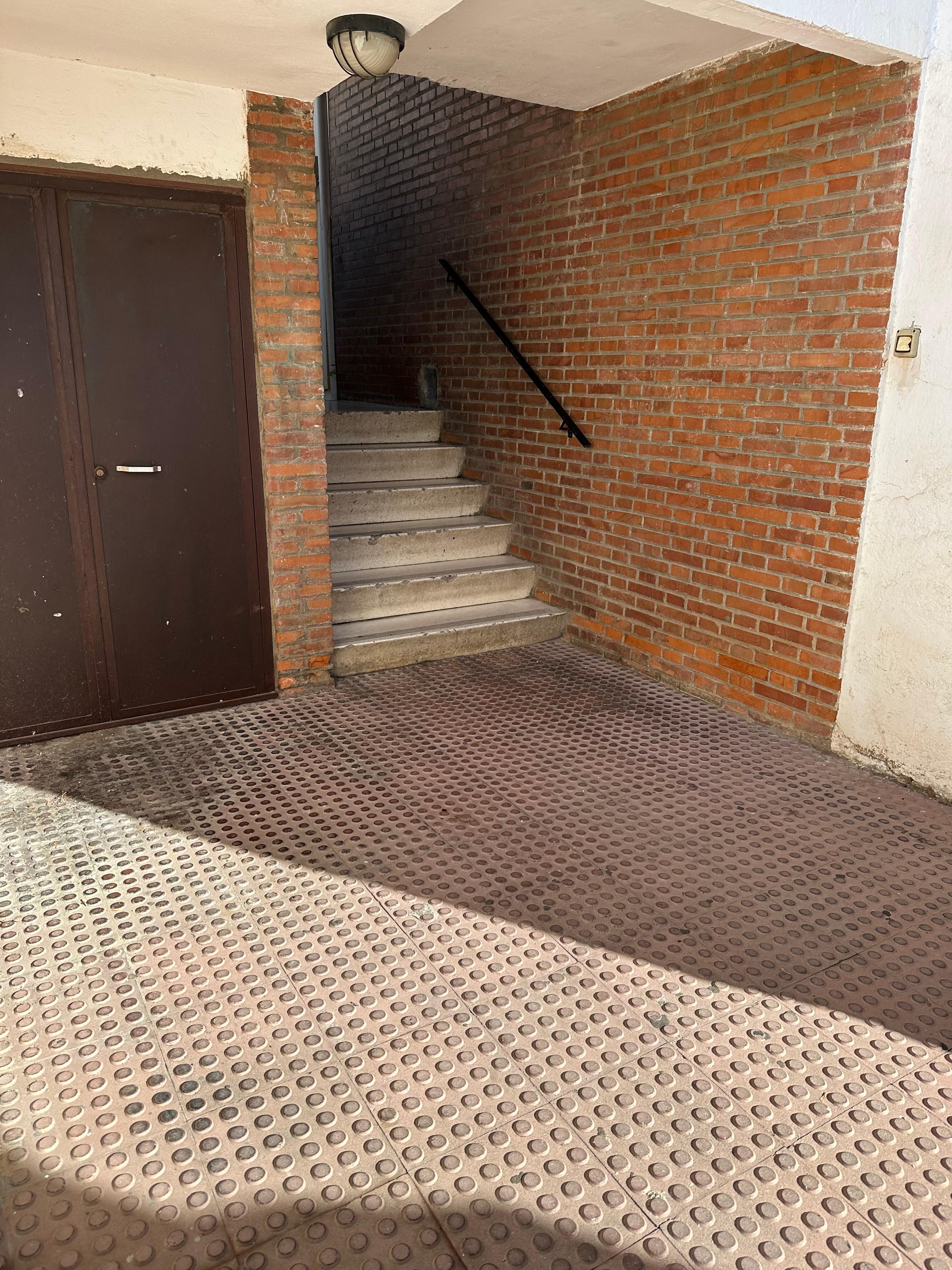 Stairs to apartment complex from street entrance 