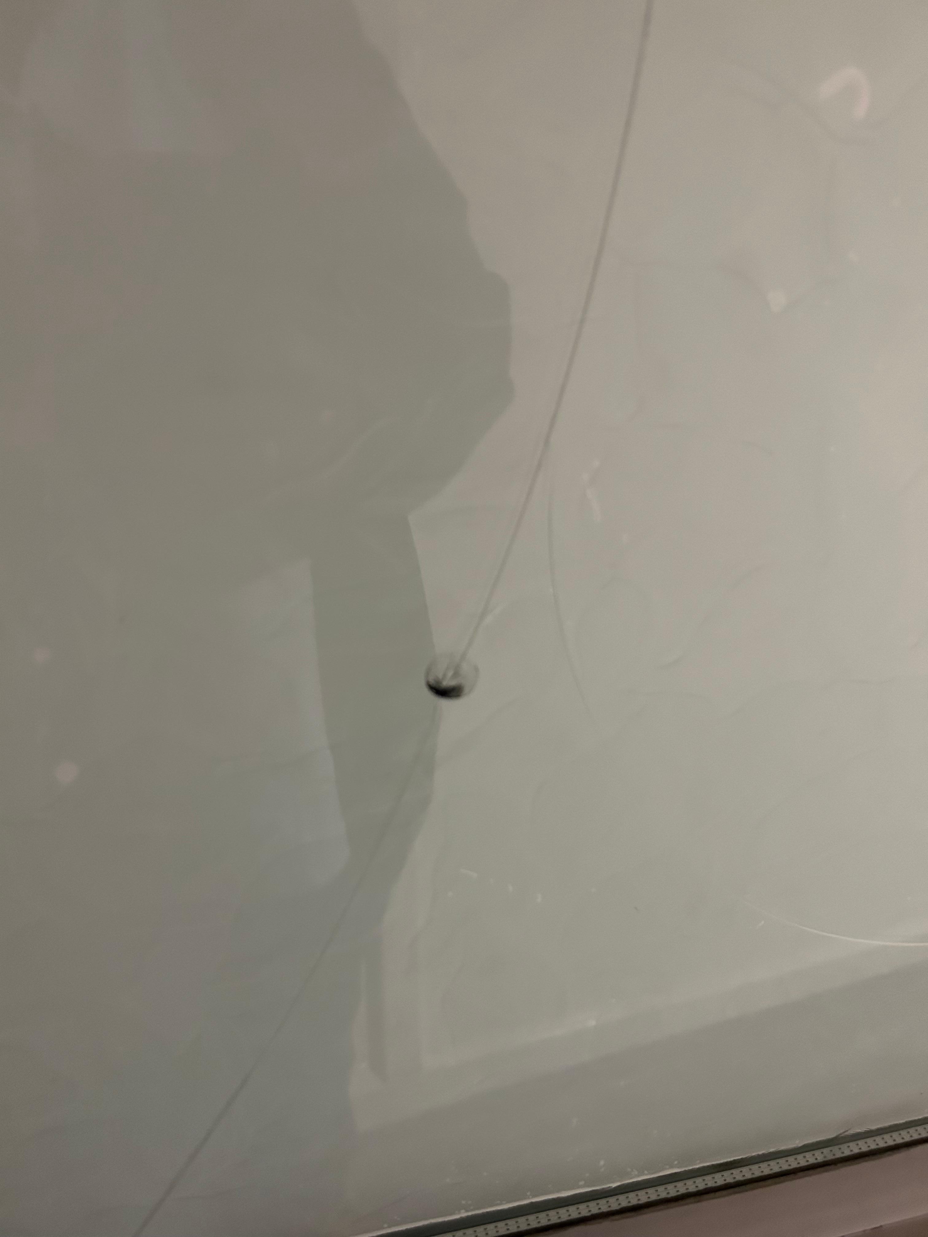 Bullet holes on front glass door not very safe 