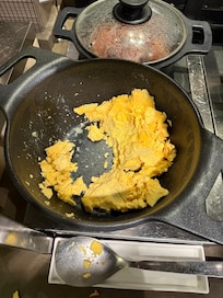 Very cold and hard scrambled eggs at breakfast