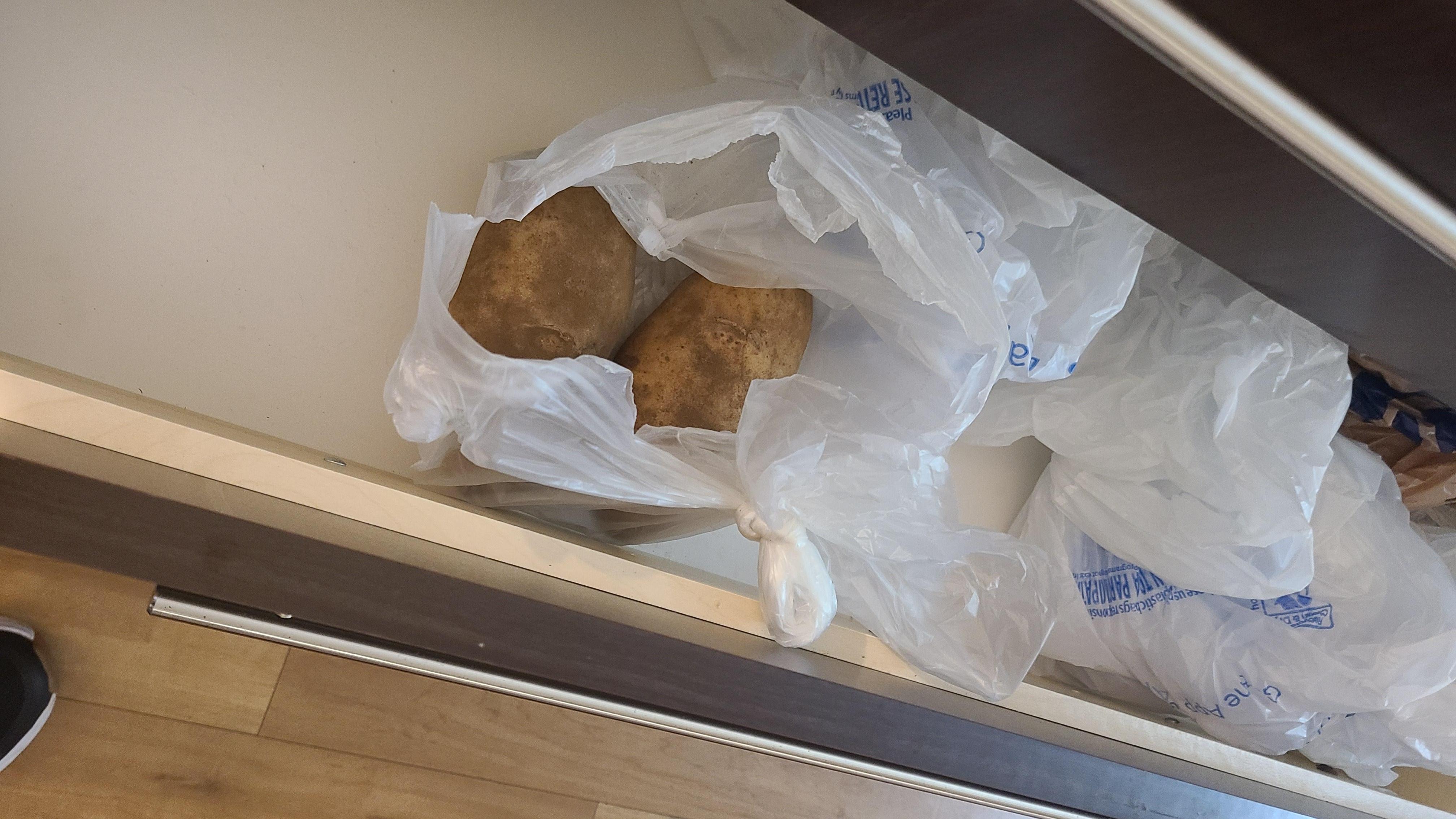 Potatoes in a drawer. 