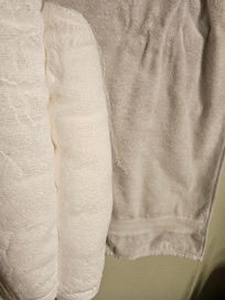 2 New towels in contrast with existing "white" towels in home