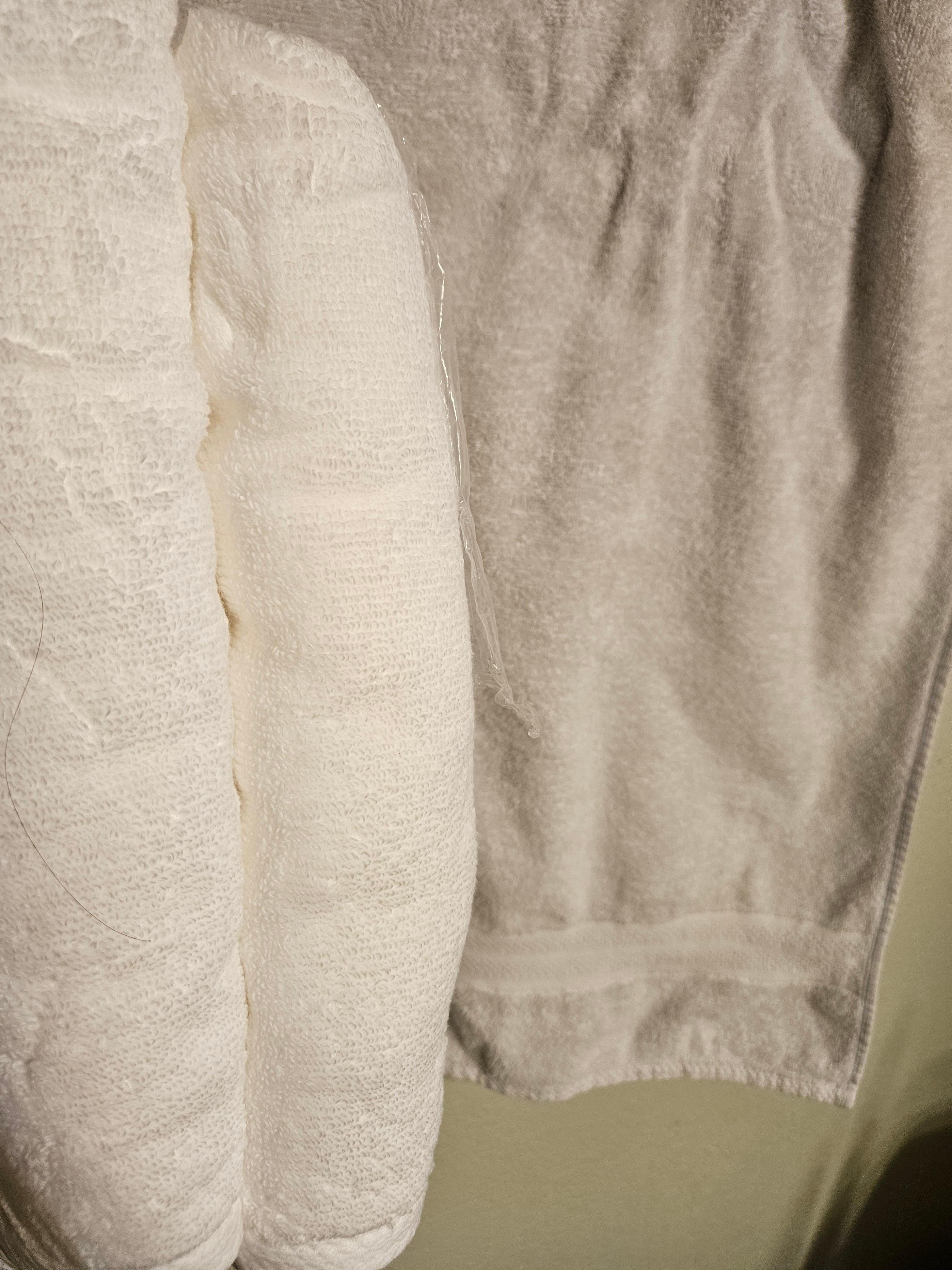2 New towels in contrast with existing "white" towels in home 