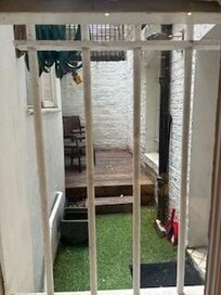 Actual outdoor space which we could not access due to the door being stuck.