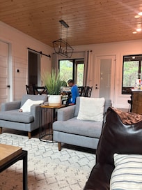 My son was sitting at the table to eat some steak!